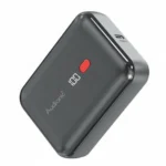 Dark grey Audionic Tesla T10 10000mAh power bank with digital display showing '100', red button, and Type-C port.